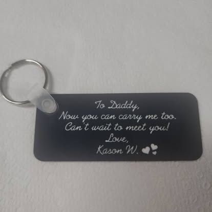A keychain that says to daddy now you can carry me too can 't wait to meet you love mason w.