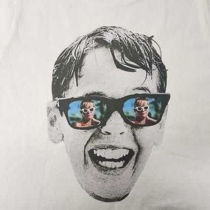 A black and white photo of a man wearing sunglasses