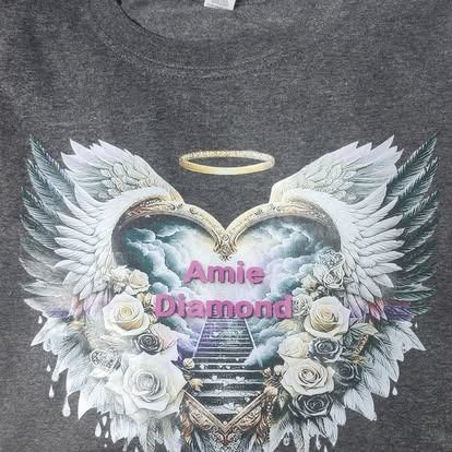 A t-shirt with a heart with angel wings and the name amie diamond on it
