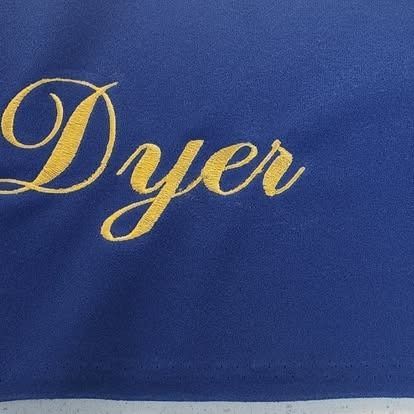 A blue cloth with the word dyer embroidered on it