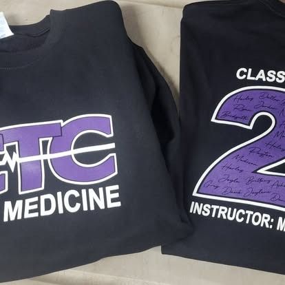 Two black shirts with the words tc medicine on them
