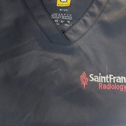A black shirt with a saint fran radiology logo on it