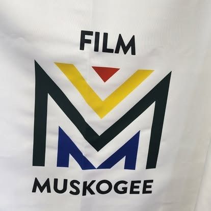 A close up of a film muskogee logo