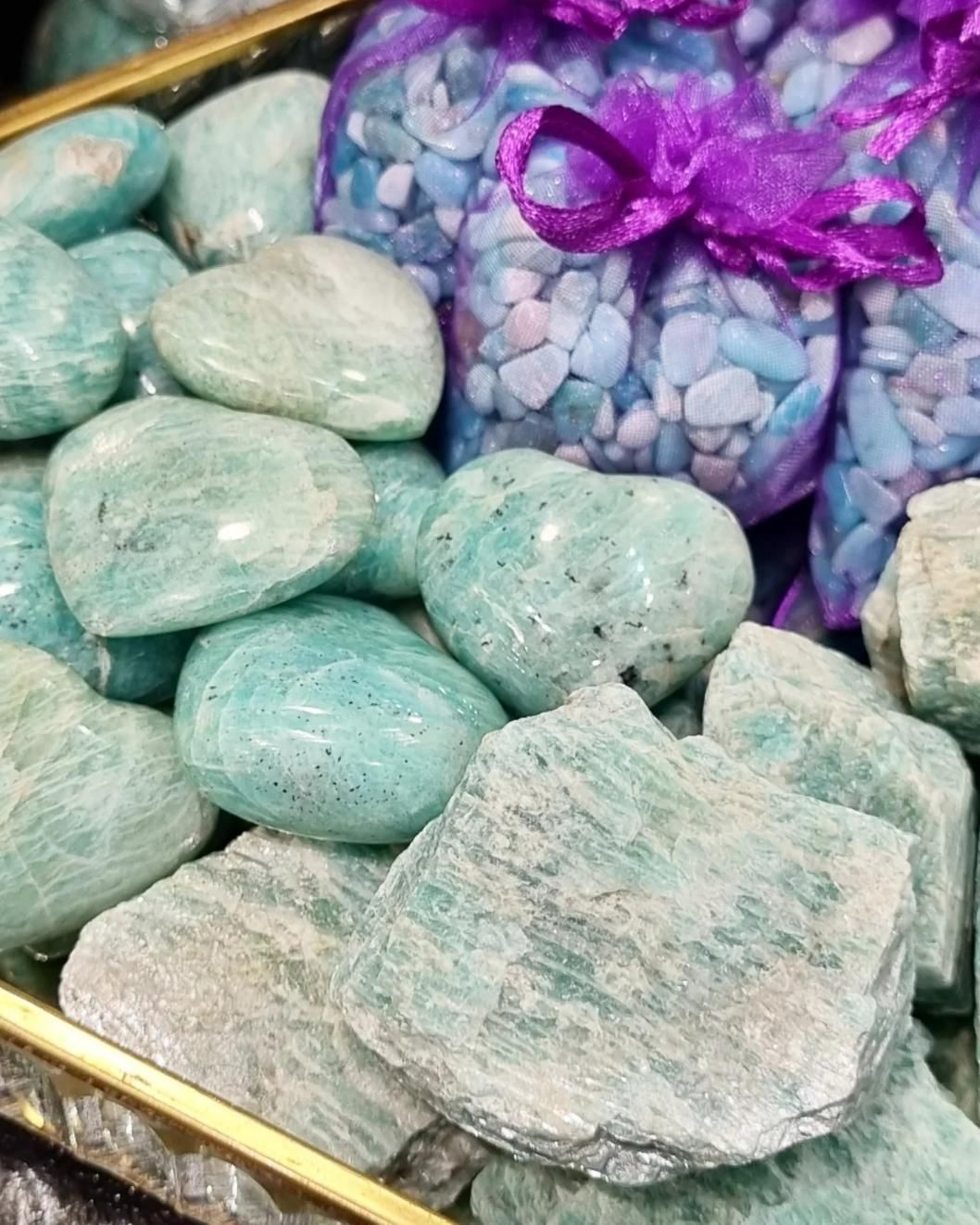 A Pile of Rocks with Purple Bags of Rocks in The Background