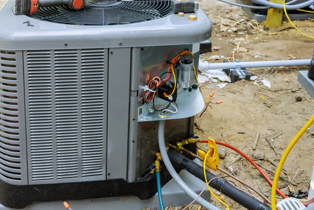 an air conditioner is being repaired on a construction site