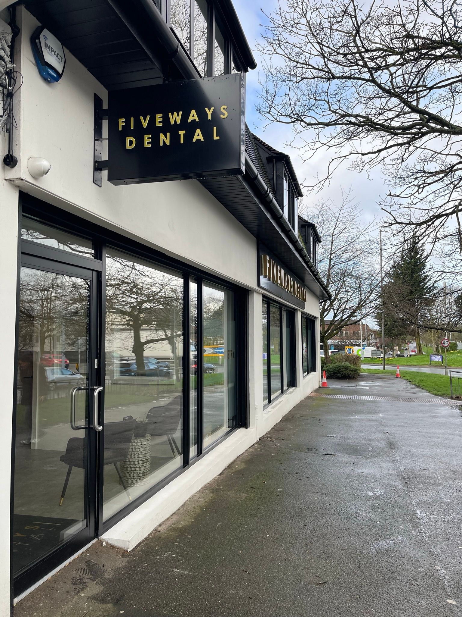 A building with a sign that says fiveways dental on it.