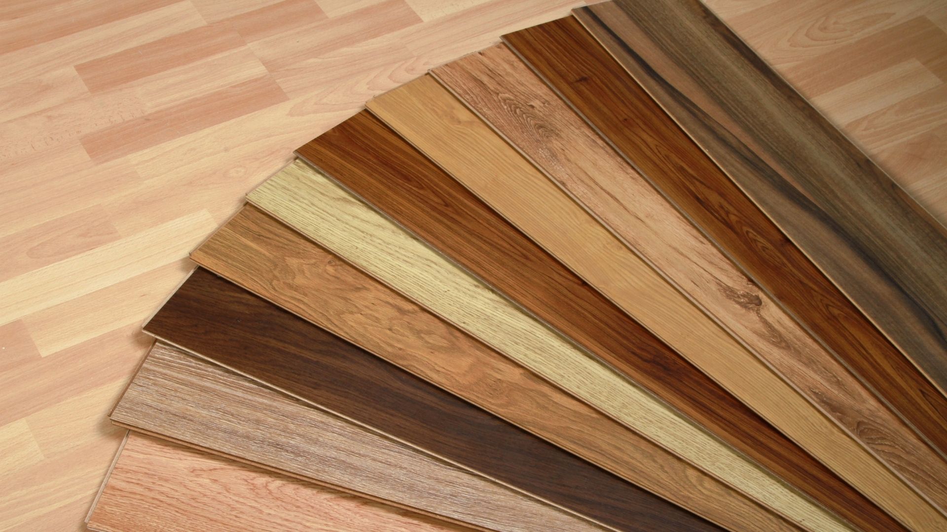 Variety of wood flooring samples in different colors and textures.