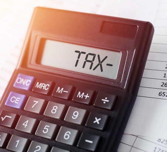 Word Tax on Calculator — Brooklyn, NY — BATISTA & ASSOCIATES CORP.
