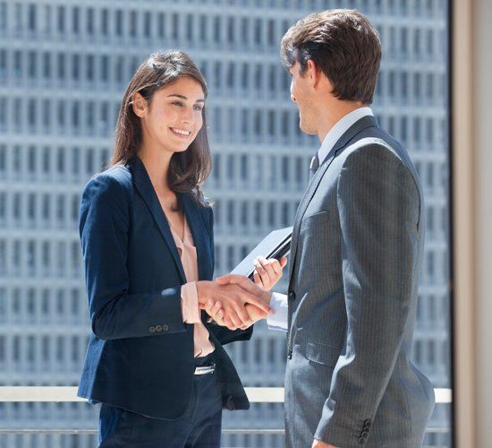Business People Shaking Hands — Brooklyn, NY — BATISTA & ASSOCIATES CORP.