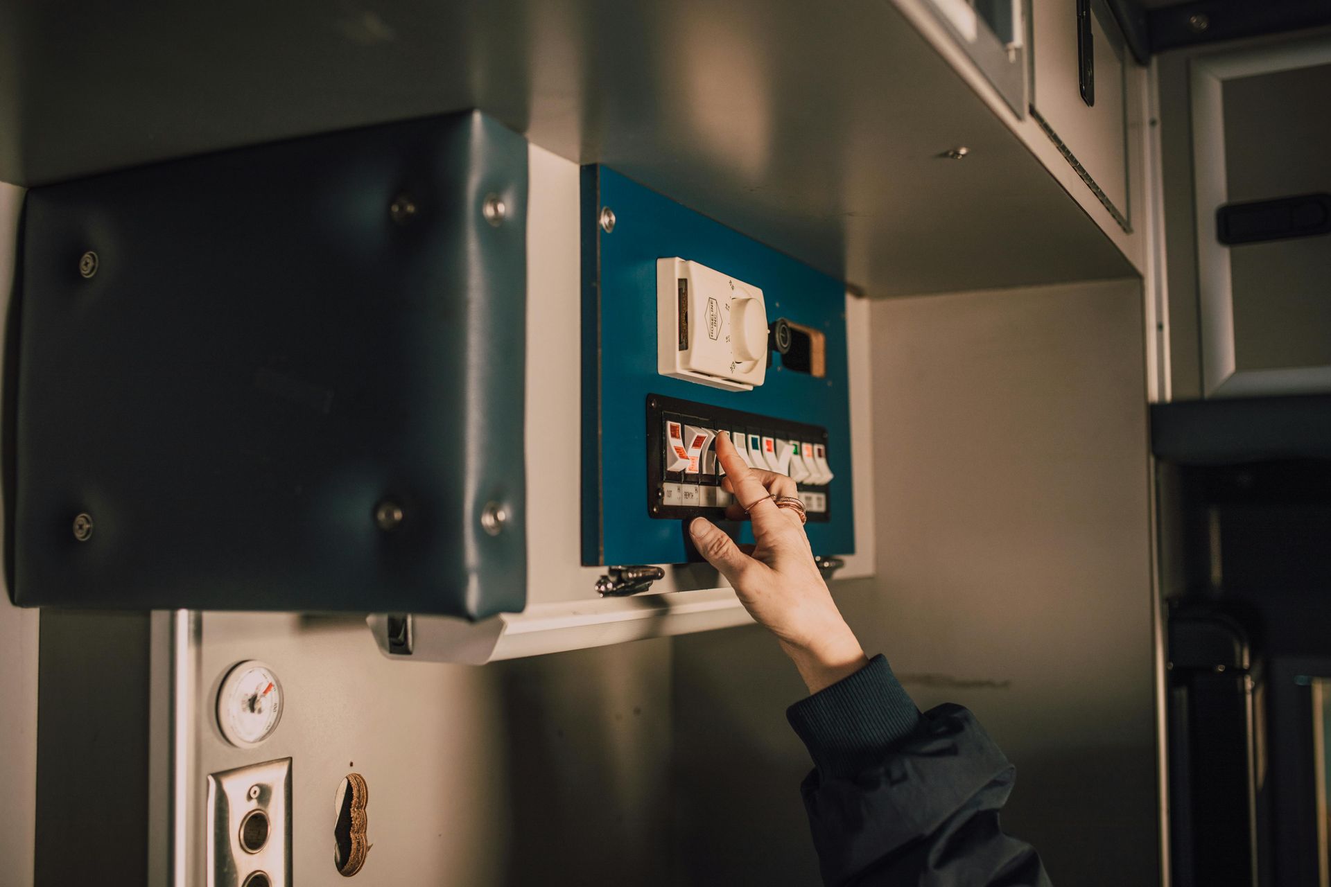 Electrician in Gloves Cutting Wires at an Electrical Outlet — Ionspark Electrical in Atherton, QLD