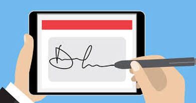 A person is signing a document on a tablet with a pen.