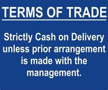 A blue sign that says terms of trade strictly cash on delivery unless prior arrangement is made with the management