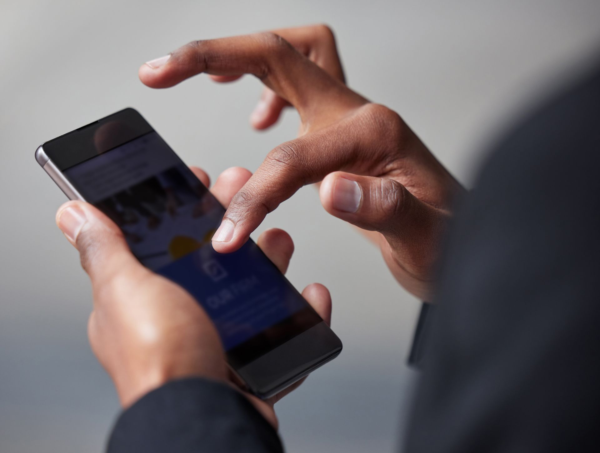 A close up of a person using a cell phone