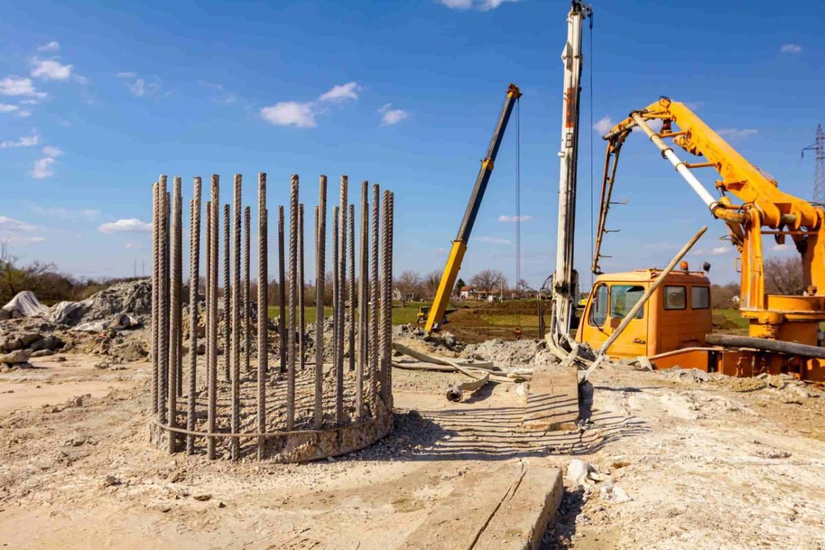 A Construction Site With A Crane And A Concrete Pump — Lonnie Henderson Concreting In Kurri Kurri, NSW