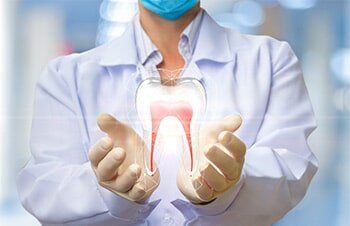 Dentist holding Teeth figure - Dental care in San Pablo, CA