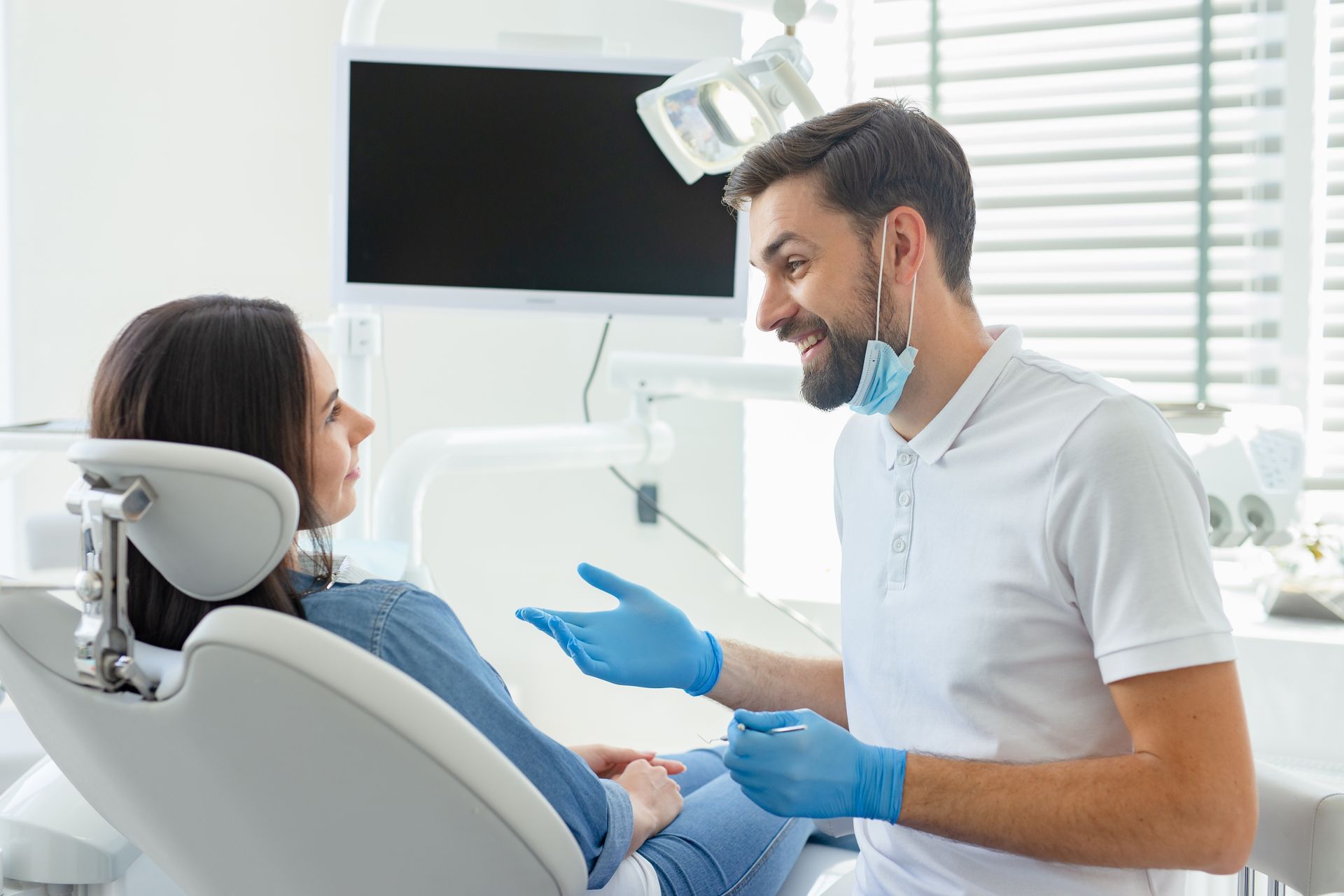 Dentist and patient discussing dental care options