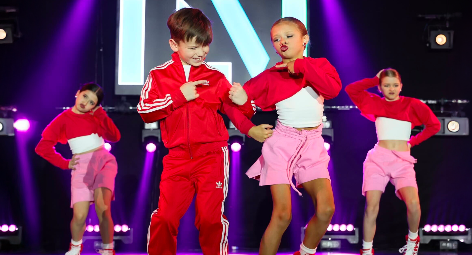 little girl and boy dancing happily