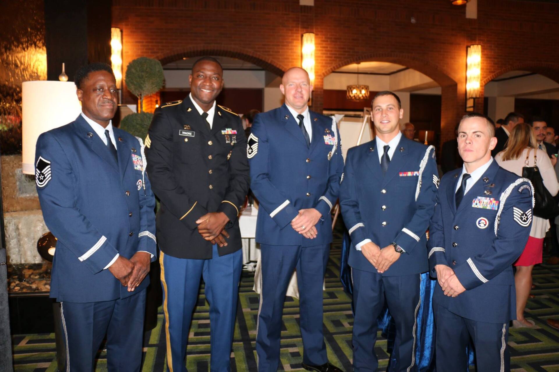 A group of men in military uniforms are posing for a picture