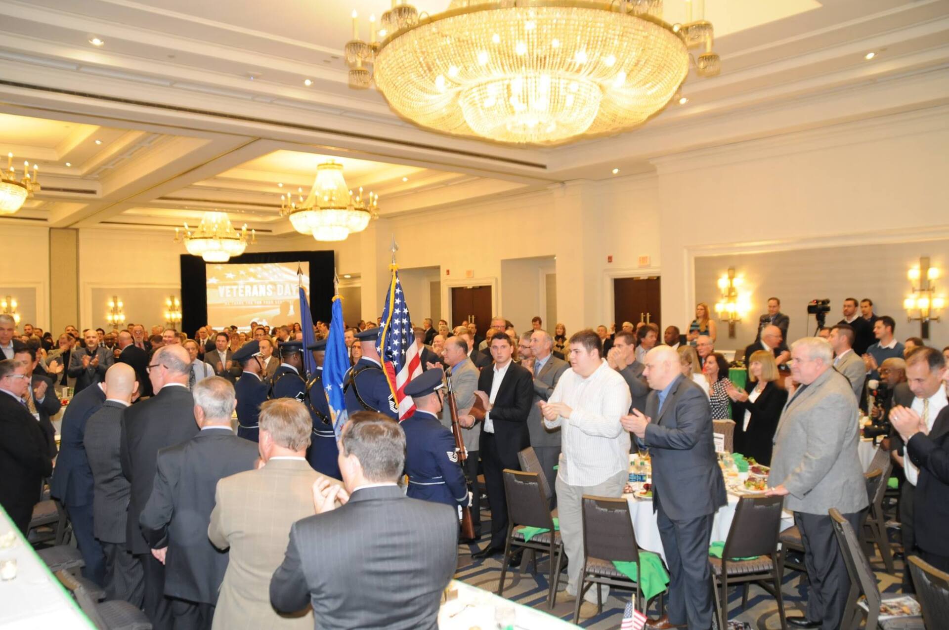 A large group of people are gathered in a large room.