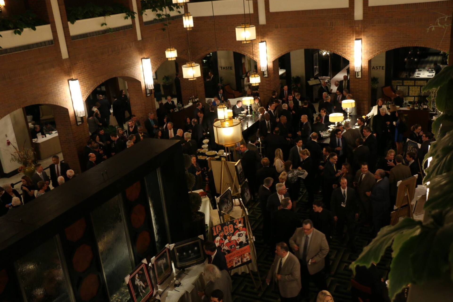 A large group of people are gathered in a large room