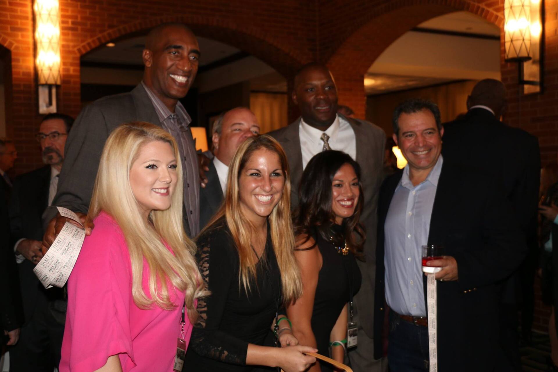 A group of people posing for a picture in a room