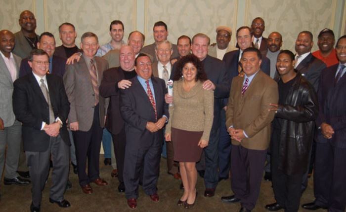 A group of men and women posing for a picture