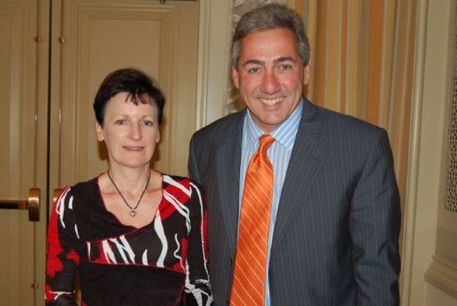 A man and a woman are posing for a picture together