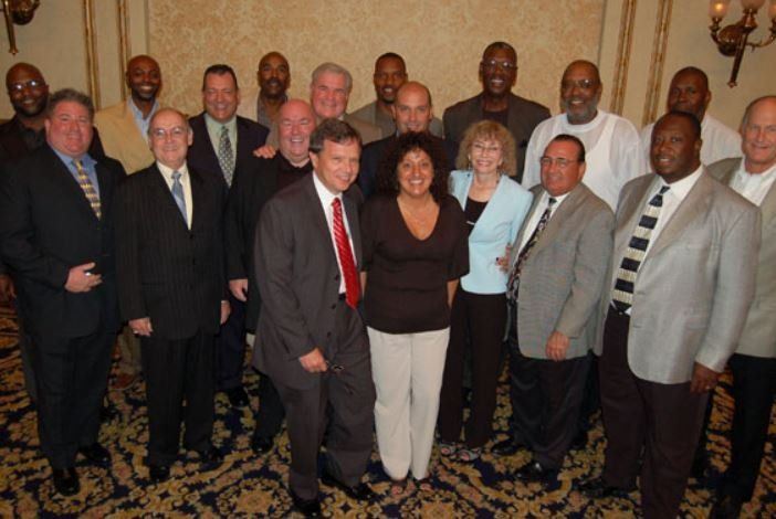 A group of people posing for a picture in a room