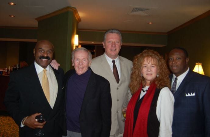 A group of people are posing for a picture together