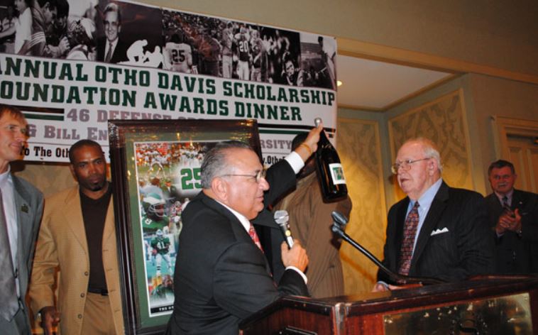 A man is giving a speech at the annual ohio davis scholarship foundation awards dinner