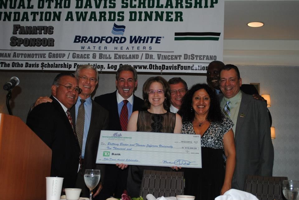 A group of people posing for a picture at a bradford white foundation awards dinner