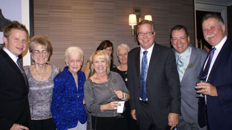 A group of people are posing for a picture together