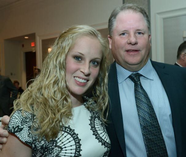 A man and a woman are posing for a picture together