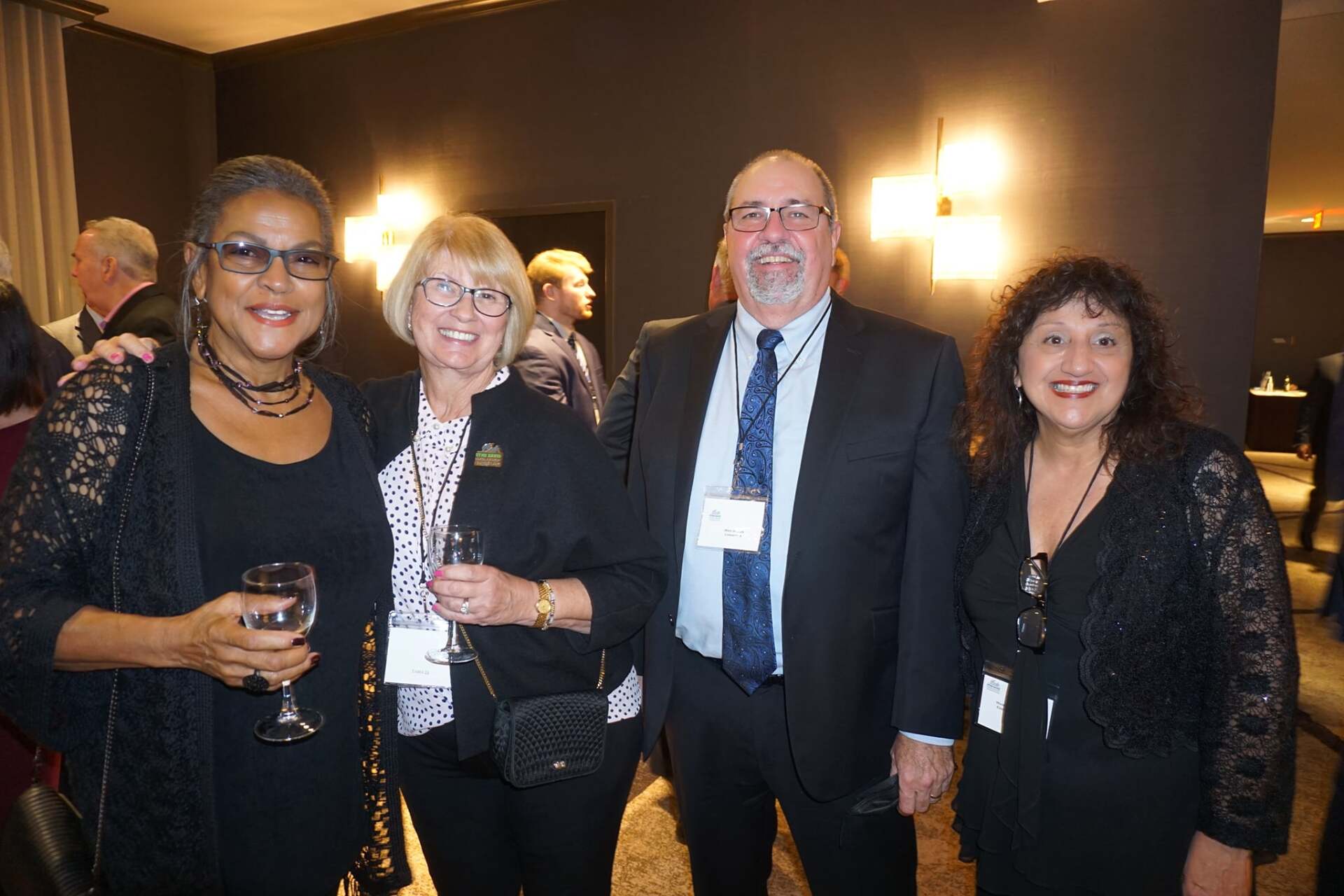 A group of people are posing for a picture at a party.