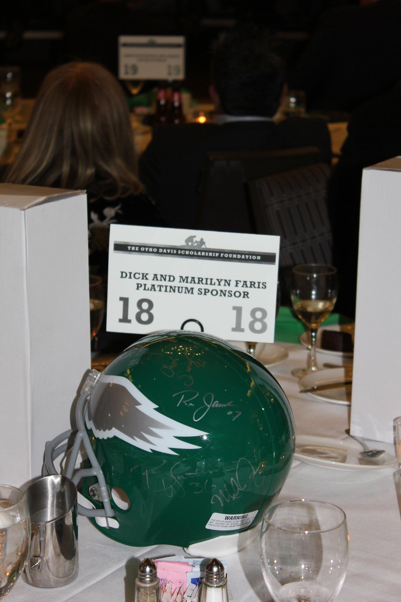 A green helmet with the number 18 on it