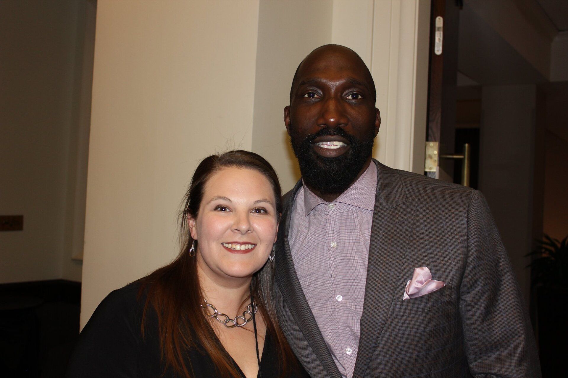 A man and a woman are posing for a picture together.