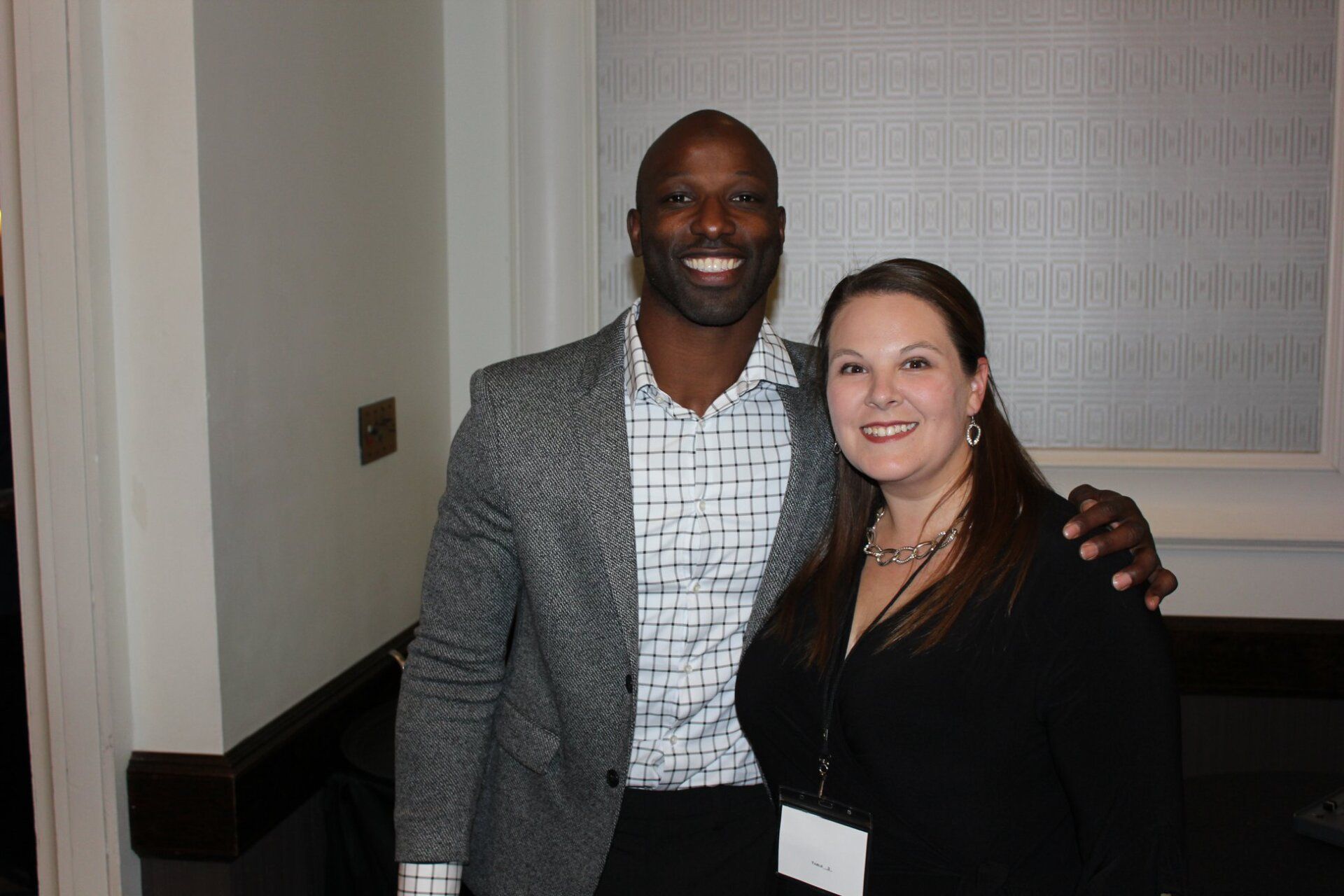 A man and a woman are posing for a picture together.