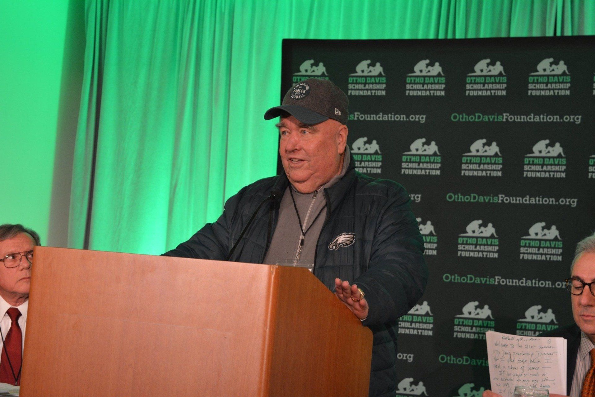 A man is standing at a podium giving a speech