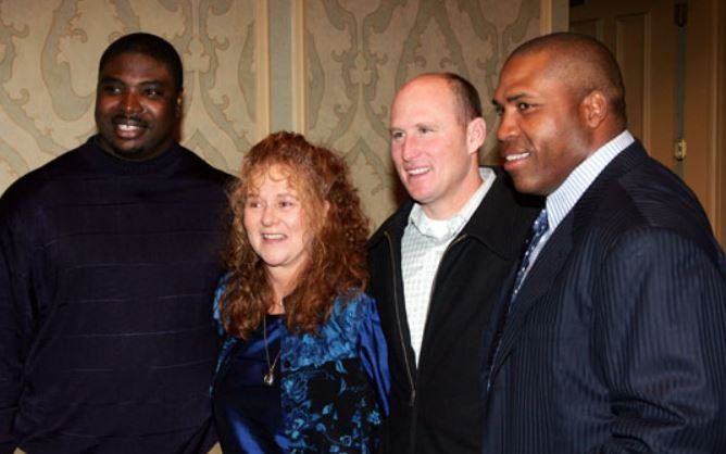 A group of people are posing for a picture together.