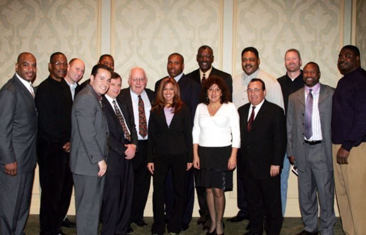 A group of business people posing for a picture