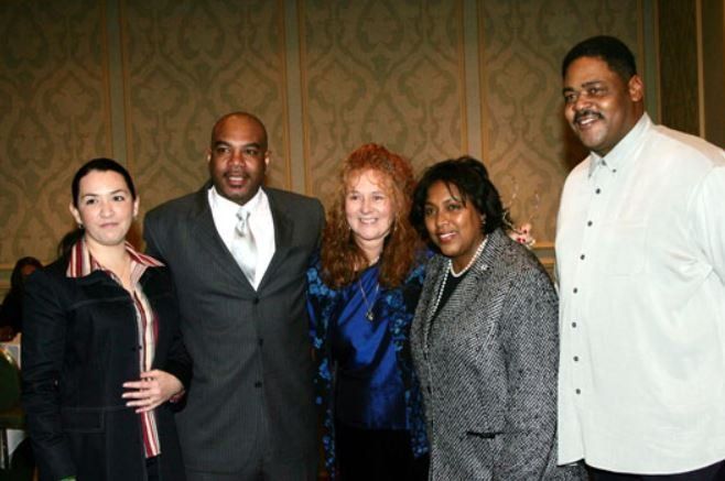 A group of people are posing for a picture together