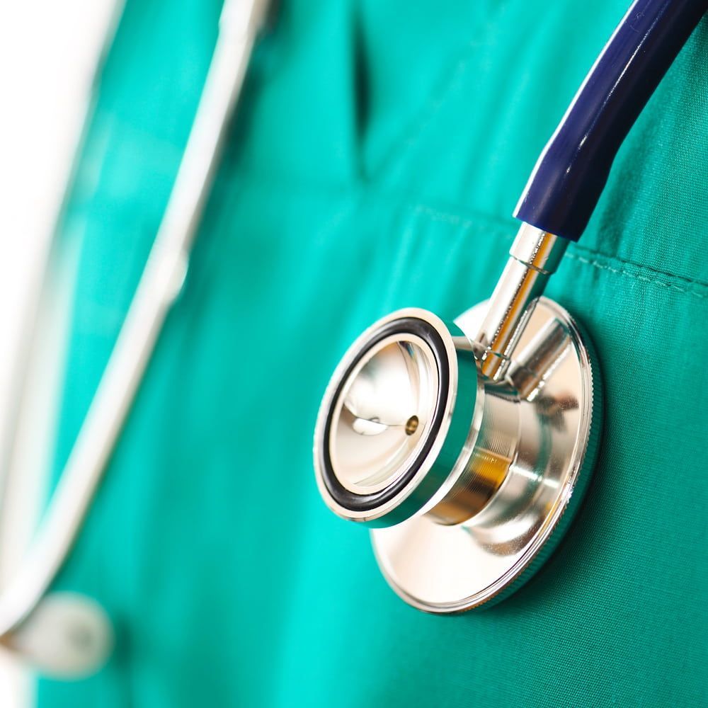 A Stethoscope Is Attached To A Green Scrub — Mall Medical Centre In Alice Springs, NT