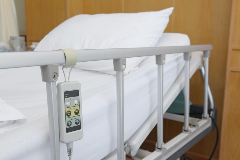 A Hospital Bed With A Remote Control Attached To The Railing — Mall Medical Centre In Alice Springs, NT