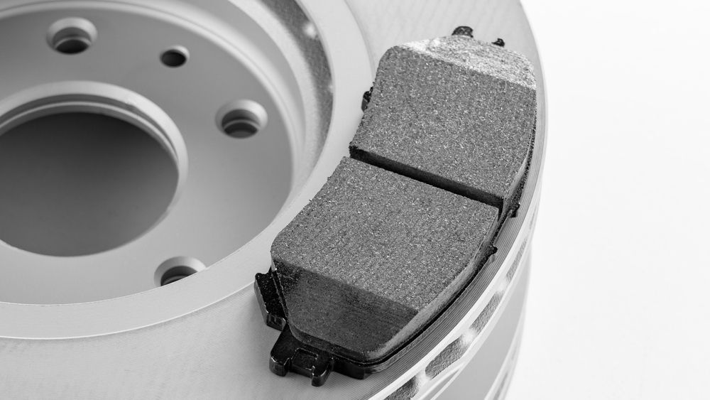 A close up of a brake pad on a brake disc.