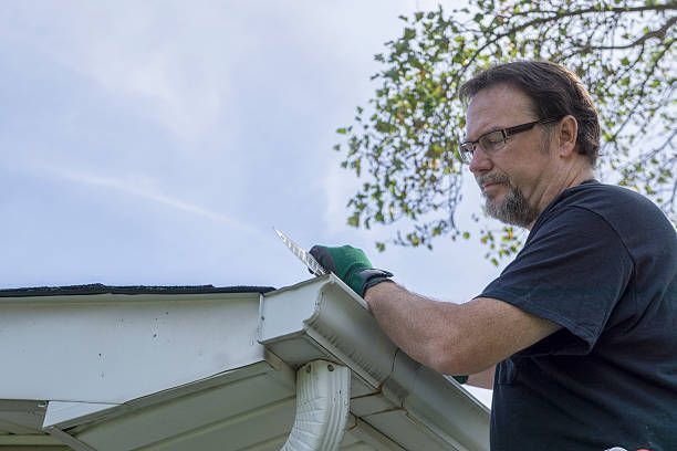 Majestic Mountain Seamless Gutters contractor doing rain gutter downspout repair Kalispell, MT