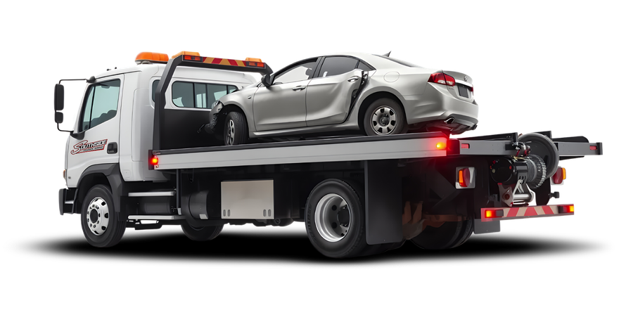 A tow truck with a car on the back of it.