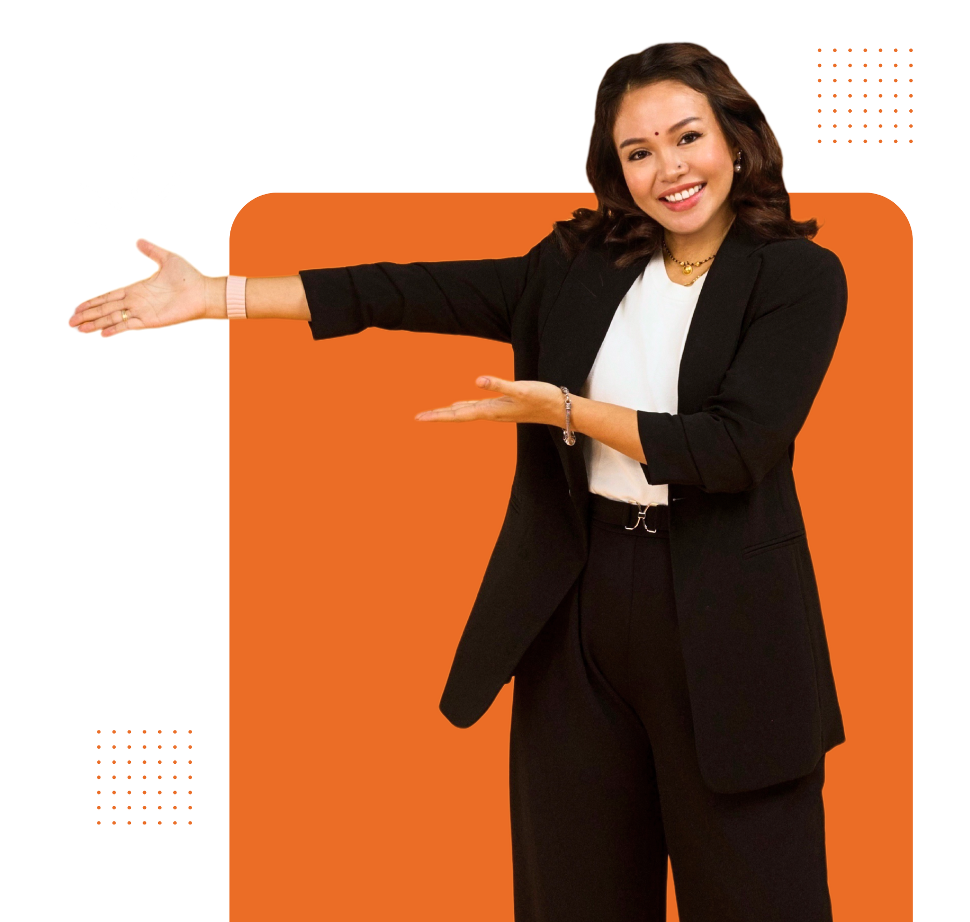 A woman in a black suit is standing with her arms outstretched.