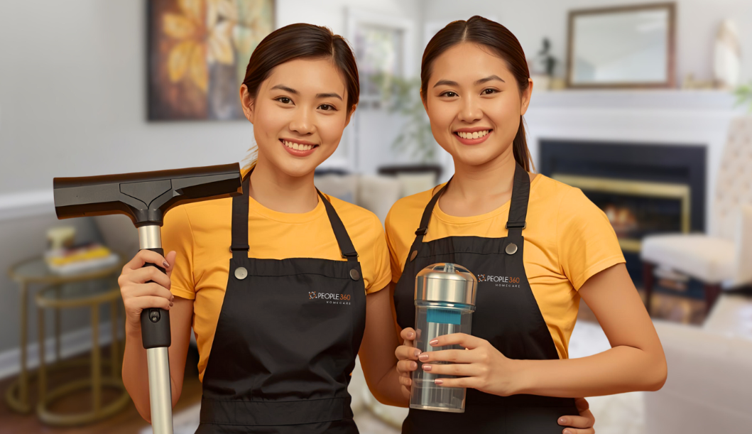 A group of people are sitting in a room with a man standing in front of them