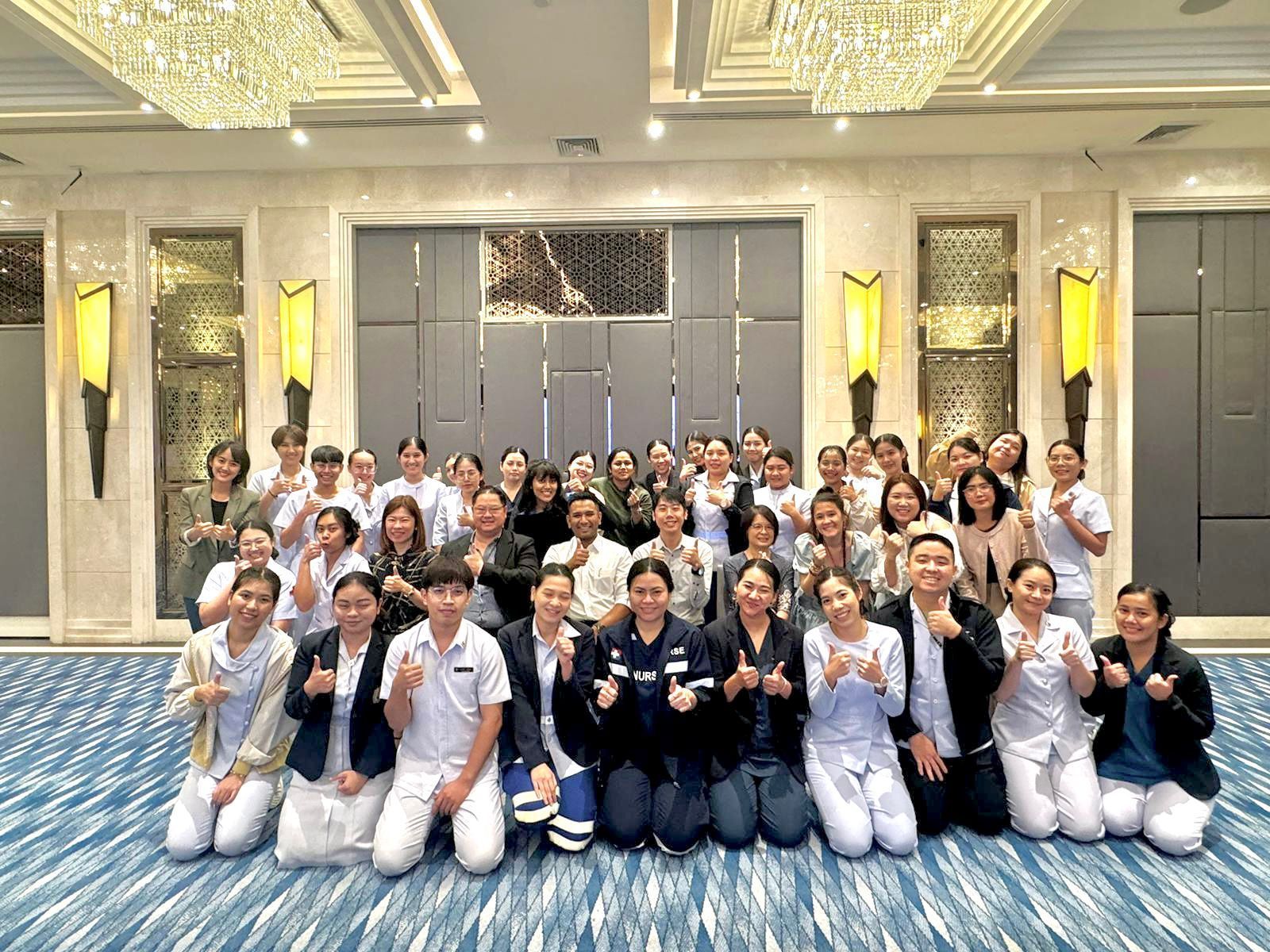 A group of people are posing for a picture in a room.