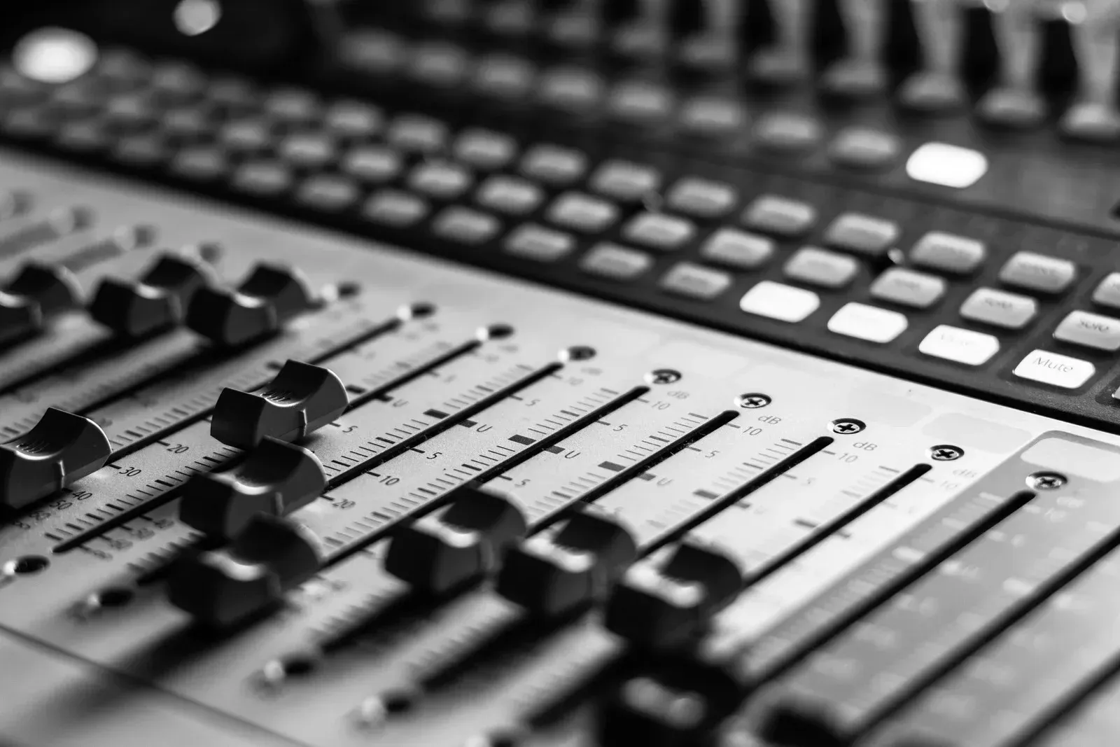 A black and white photo of a sound mixer.